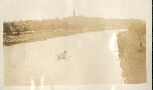 Rowing <looks like Yarra with Government House>
